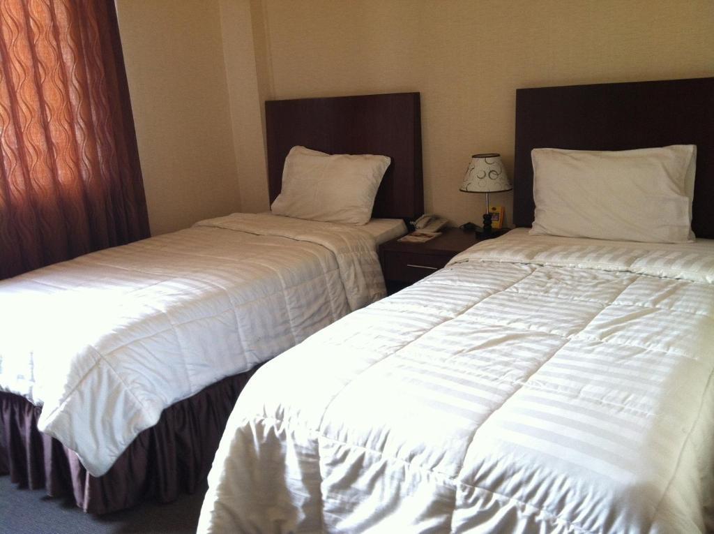 Grand Duta Hotel Palu Rom bilde